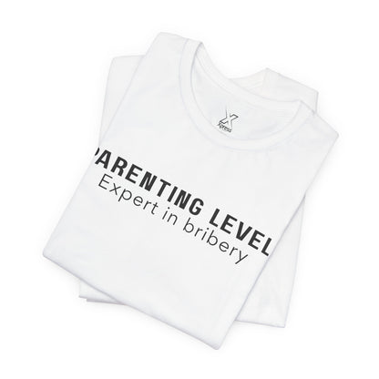 Parenting Humor Shirt | Unisex T-Shirt | Funny Parent Tee | Gift for Moms and Dads | Casual Family Outfit | “Parenting Level: Expert in Bribery”