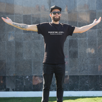 Parenting Humor Shirt | Unisex T-Shirt | Funny Parent Tee | Gift for Moms and Dads | Casual Family Outfit | “Parenting Level: Expert in Bribery”